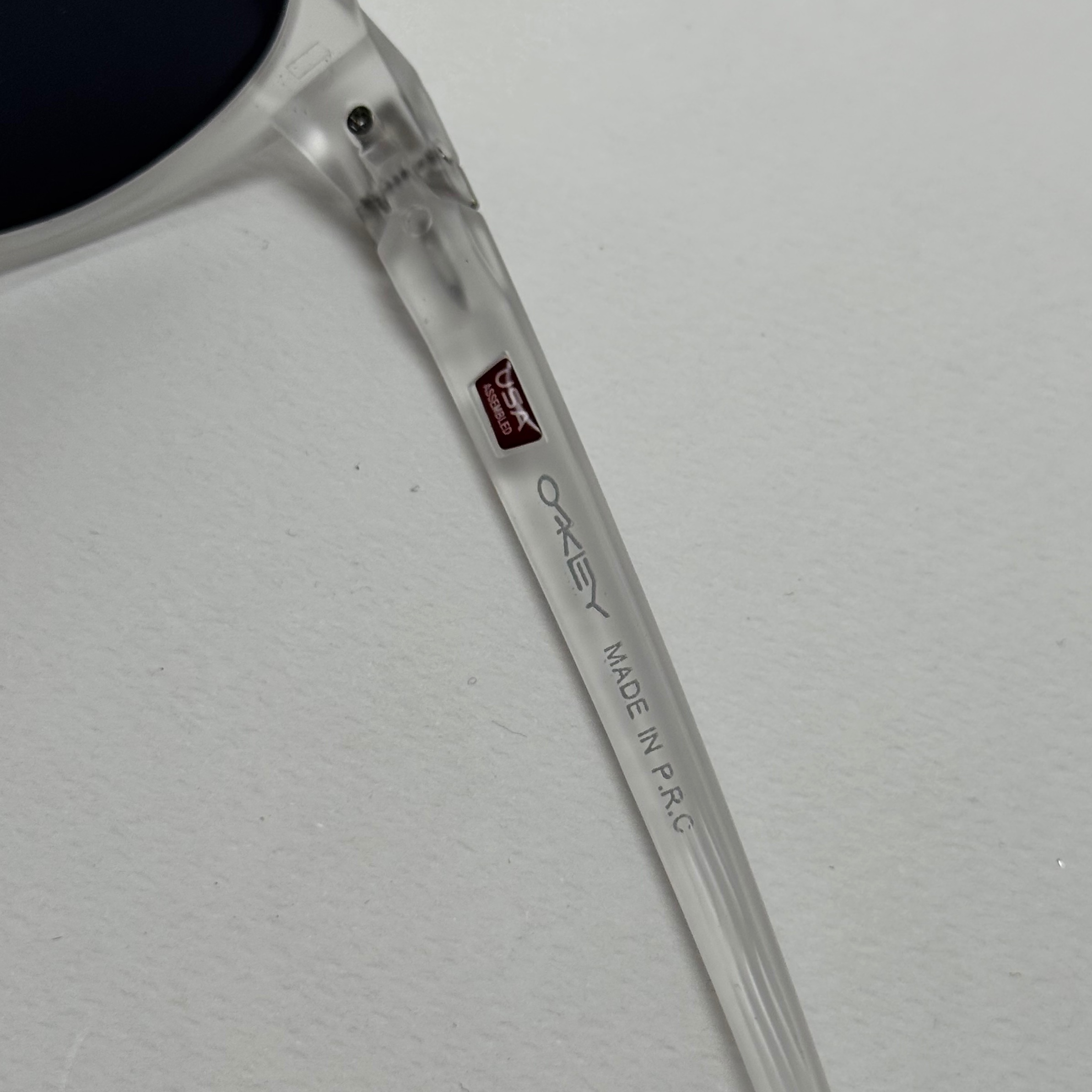 عینک آفتابی پلاریزه اوکلی Oakley فریم کریستالی عدسی مشکی گرد کد TO4910