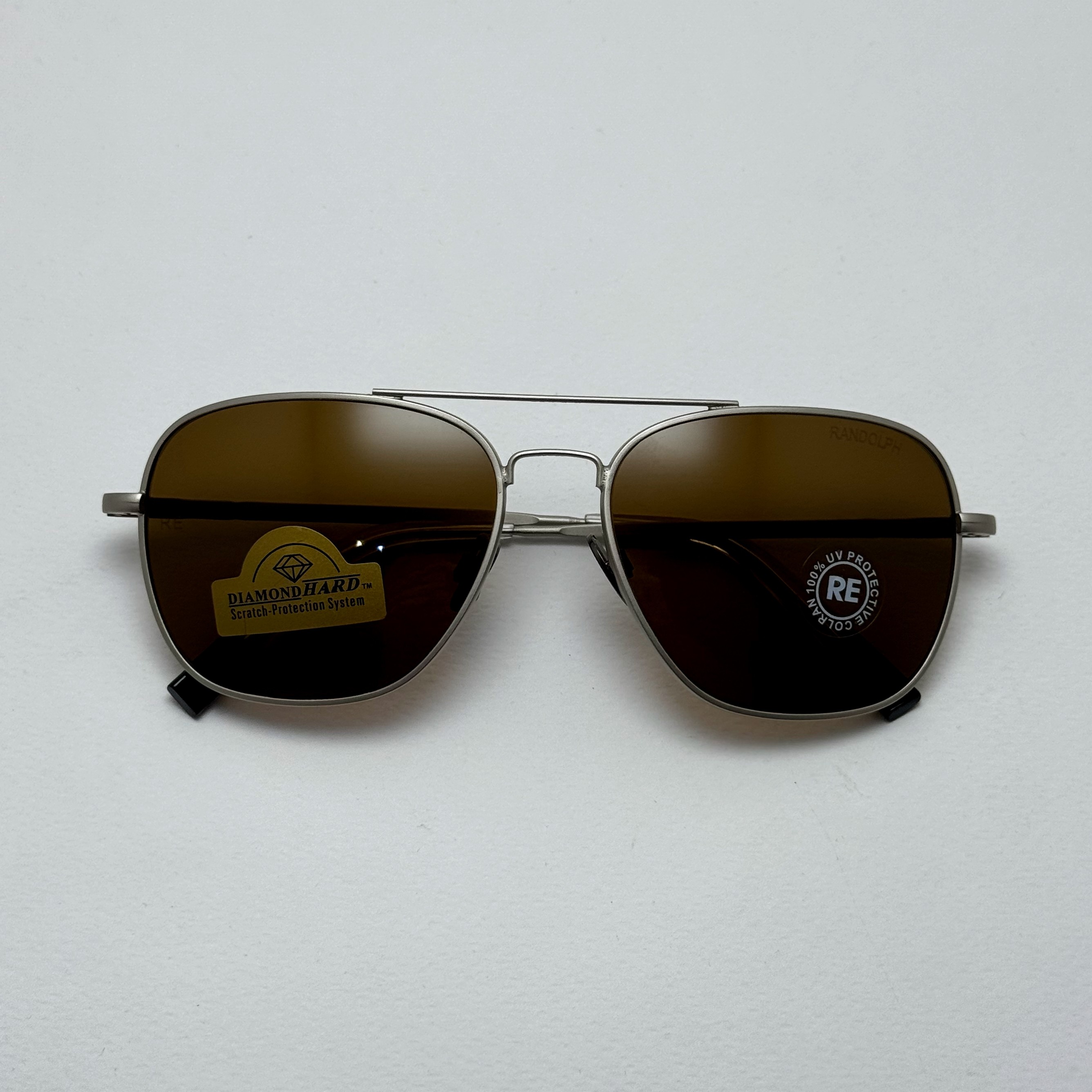 عینک آفتابی خلبانی رندولف شیشه سنگ آنتی رفلکس قهوه ای فریم نقره ای فول پک RANDOLPH AVIATOR RE 58 24K White GOLD