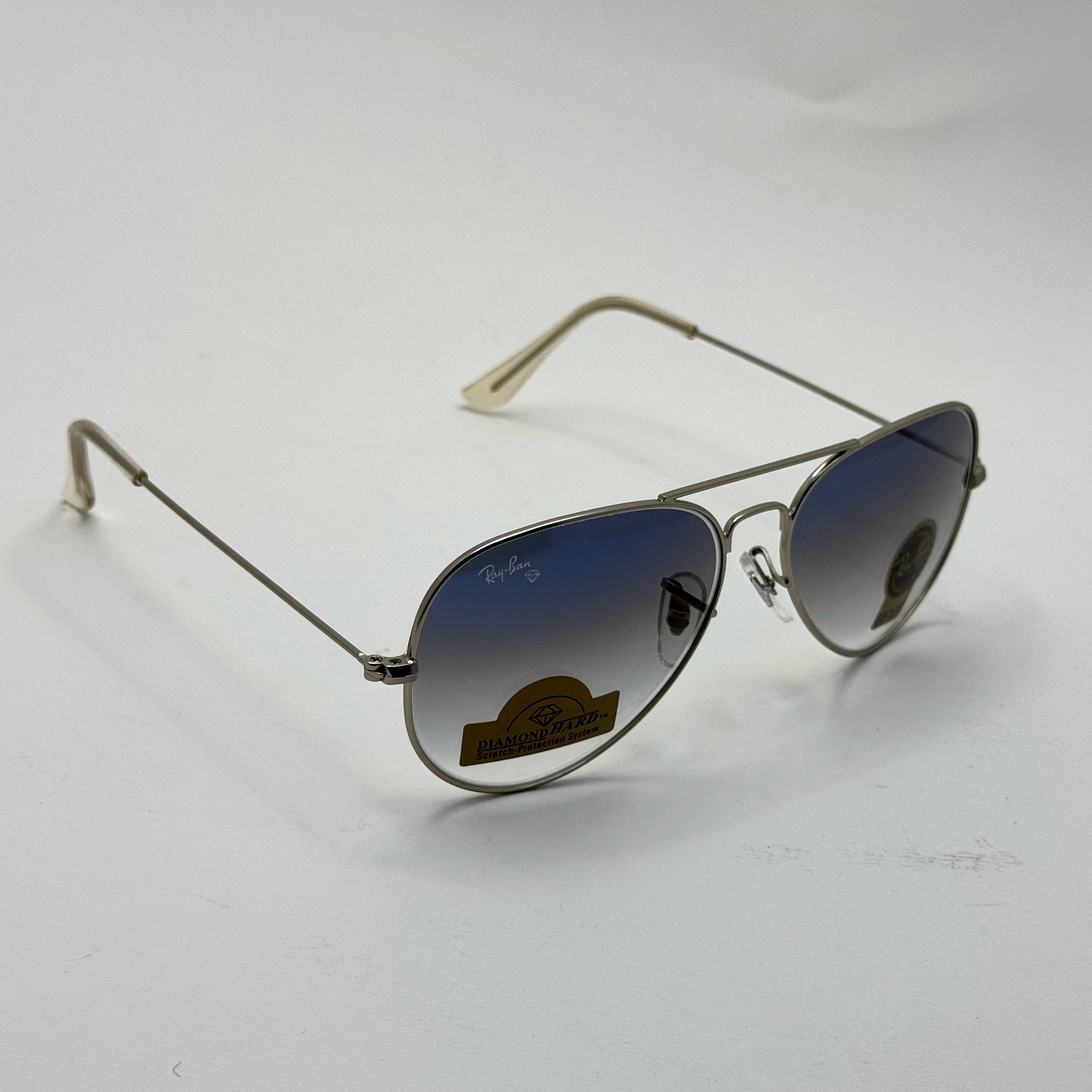 عینک ریبن خلبانی شیشه سنگ آبی هایلایت فریم نقره ای به همراه پک کامل ریبن Rayban RB 3025